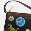 Bolsa «Plaza» de Rexy por su décimo cumpleaños, de 18 in de cuero desgastado con estampado de calcomanías