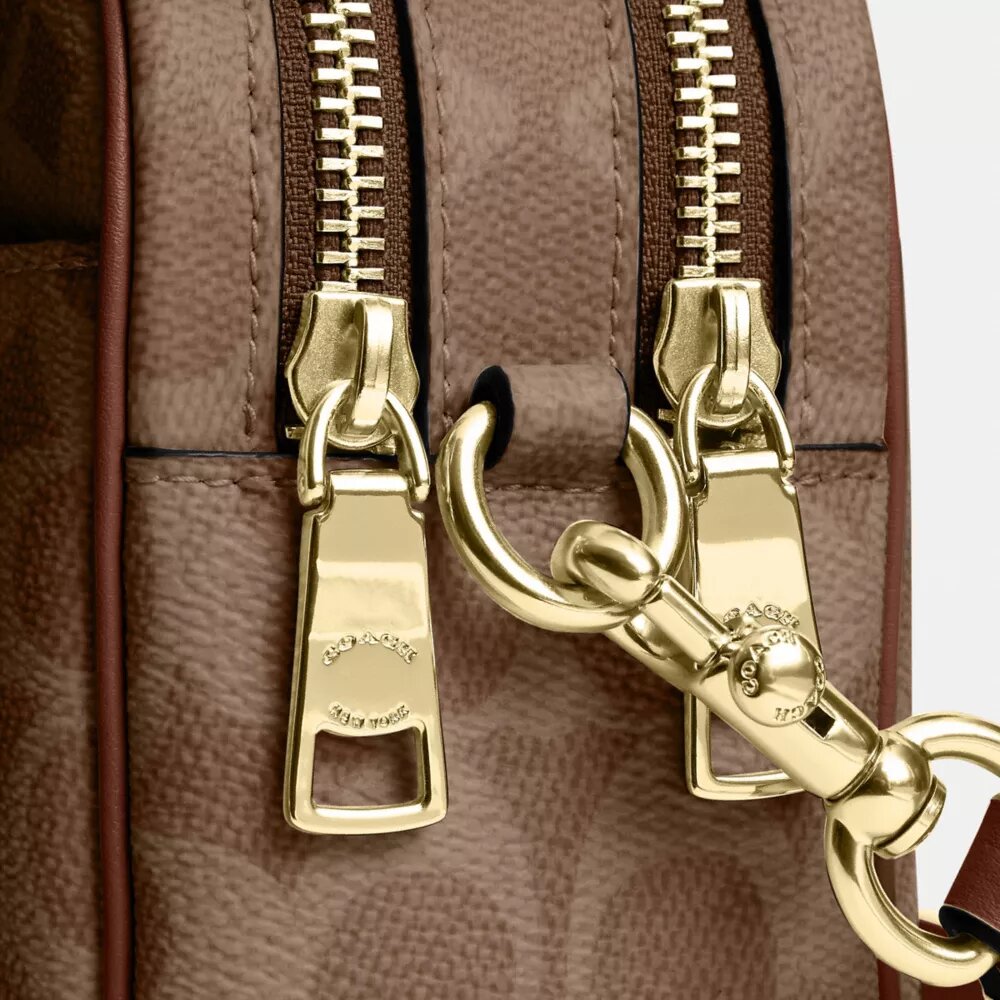 Bolso mini Carey de bandolera en Signature Canvas