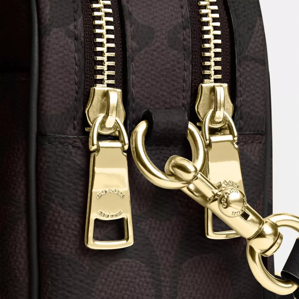 Bolso mini Carey de bandolera en Signature Canvas