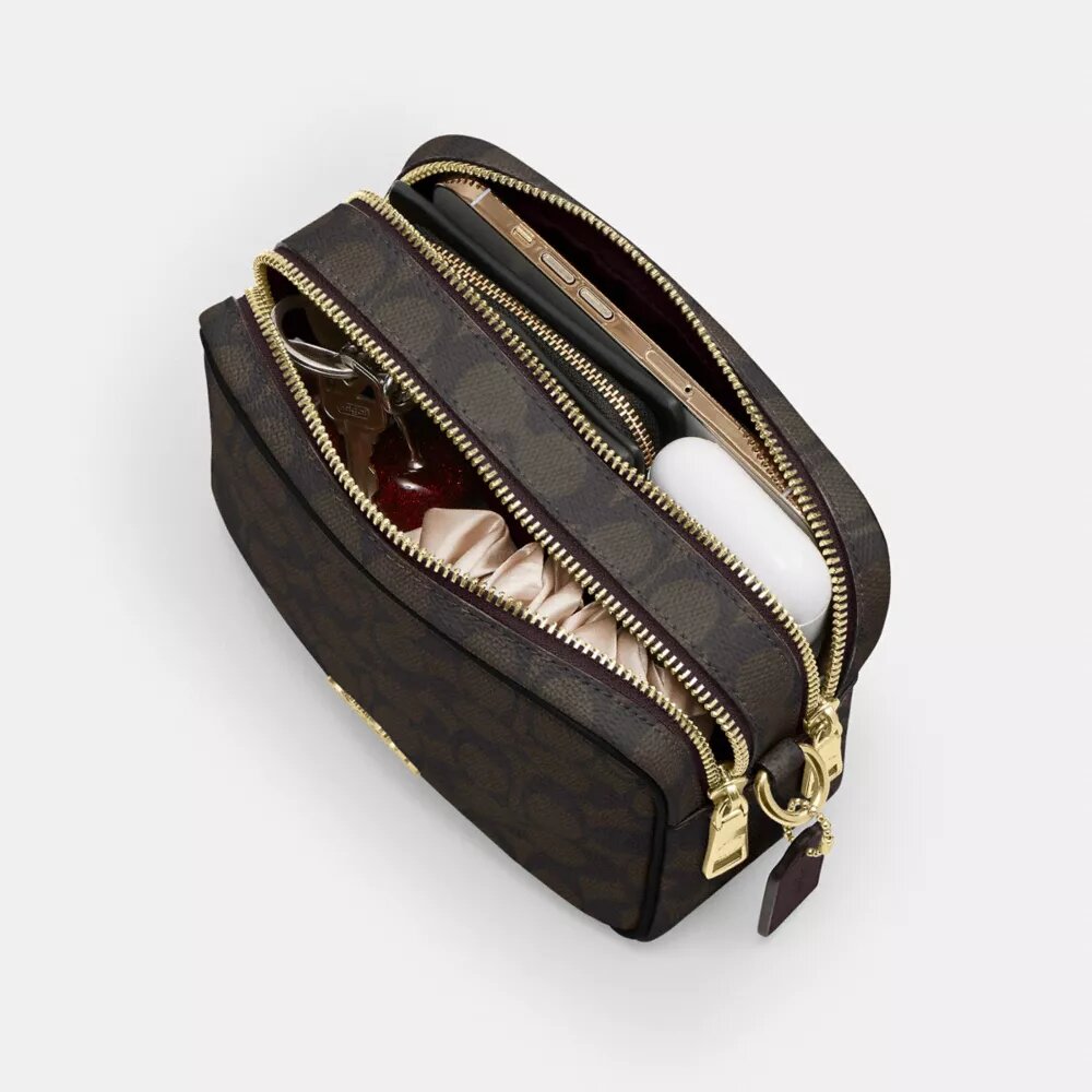 Bolso mini Carey de bandolera en Signature Canvas