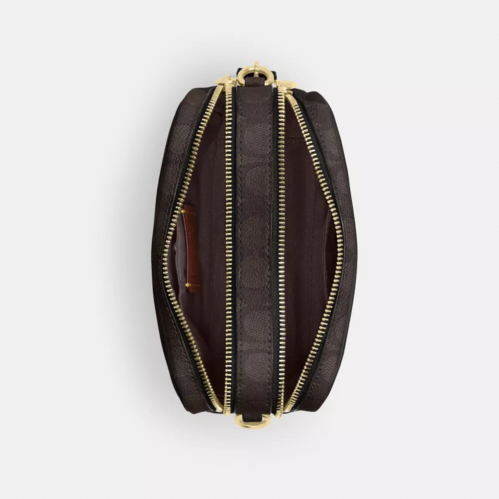Bolso mini Carey de bandolera en Signature Canvas