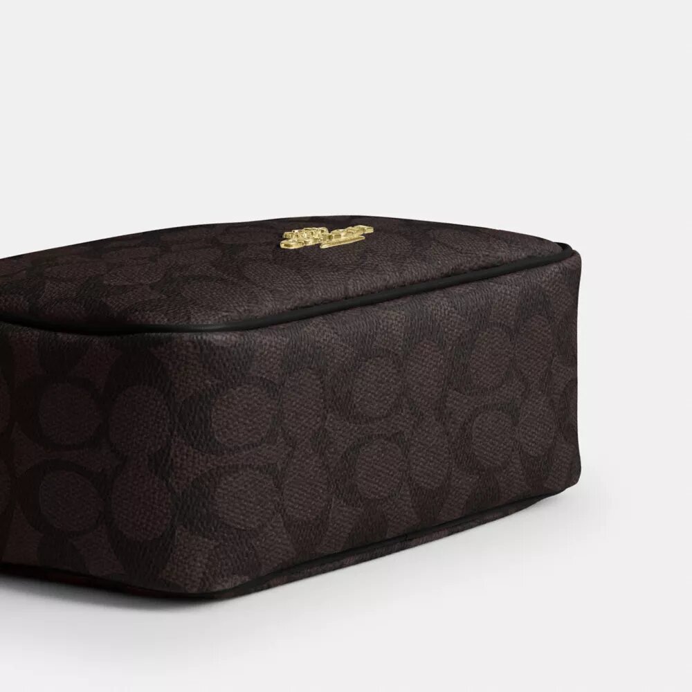 Bolso mini Carey de bandolera en Signature Canvas