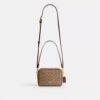 Bolso mini Carey de bandolera en Signature Canvas