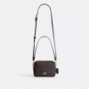 Bolso mini Carey de bandolera en Signature Canvas