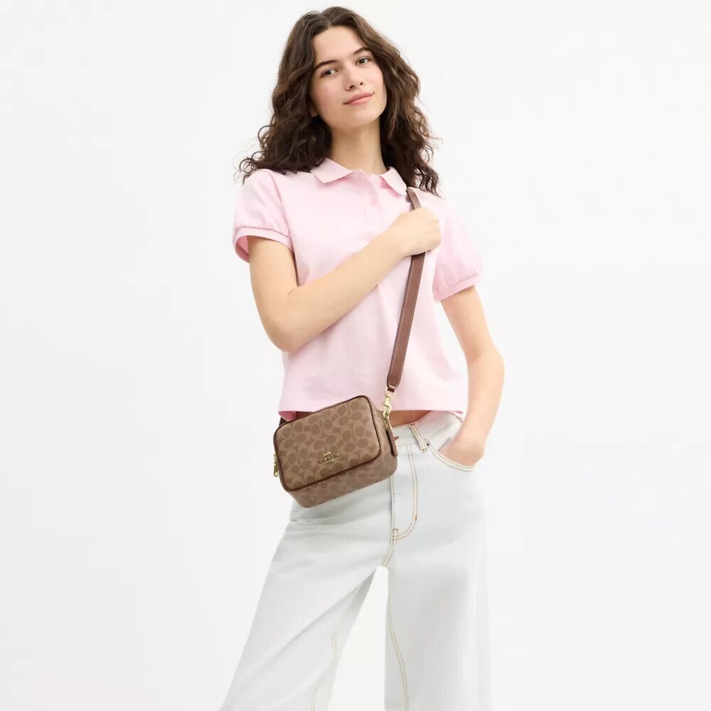 Bolso mini Carey de bandolera en Signature Canvas