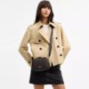 Bolso mini Carey de bandolera en Signature Canvas
