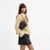 Bolso mini Carey de bandolera en Signature Canvas