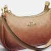 Bolso mini cruzado Teri en lona Signature Canvas