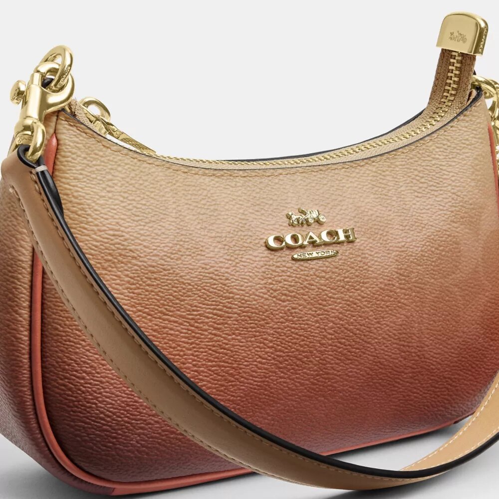 Bolso mini cruzado Teri en lona Signature Canvas