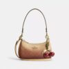 Bolso mini cruzado Teri en lona Signature Canvas