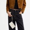 Bolsos de pulsera con cremallera en la esquina y remaches en forma de corazón