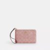 Bolsos de pulsera con cremallera en las esquinas en denim característico