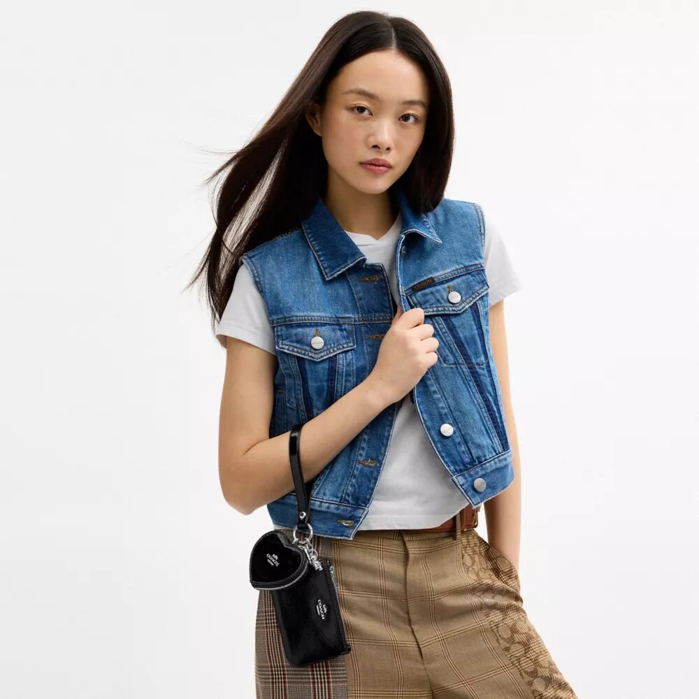 Bolsos de pulsera y neceser en forma de corazón con dije