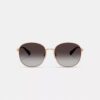 Gafas de sol redondas de metal con detalles en C