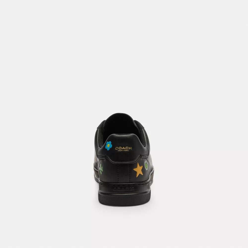 Zapatillas altas de Disney x Coach con estampado de calcomanías